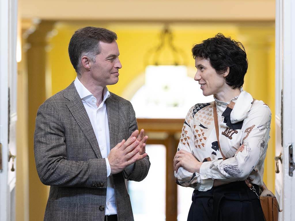 Man and woman speaking in doorway at No 6 Kildare Street